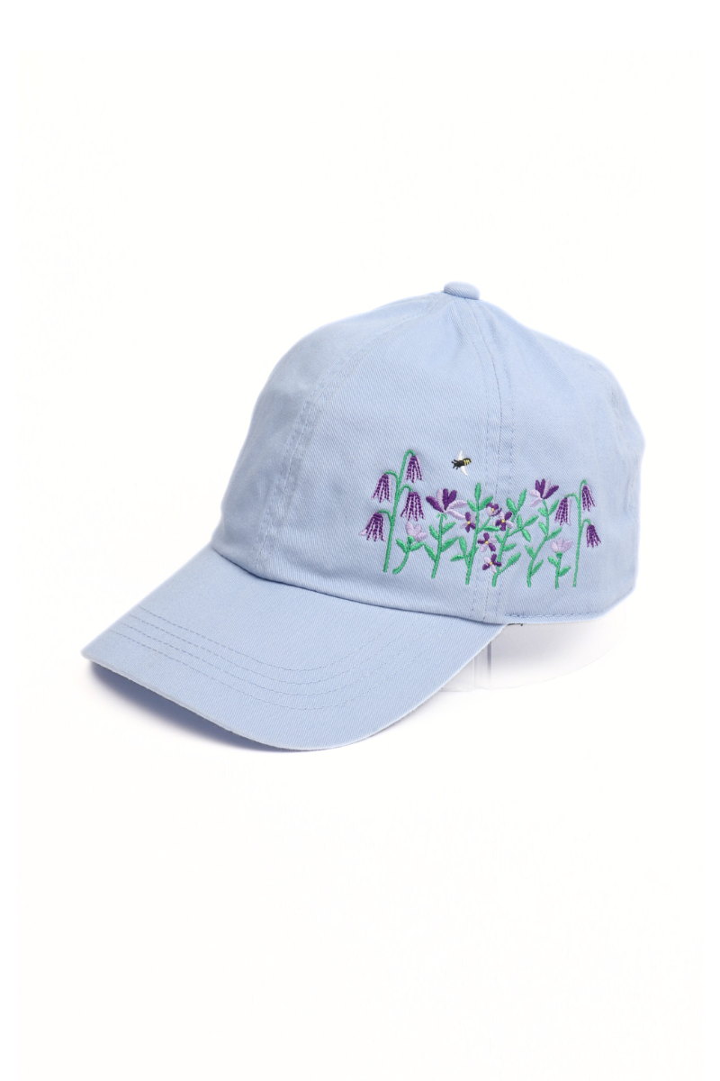 Light clue cotton cap with flowers and bee.