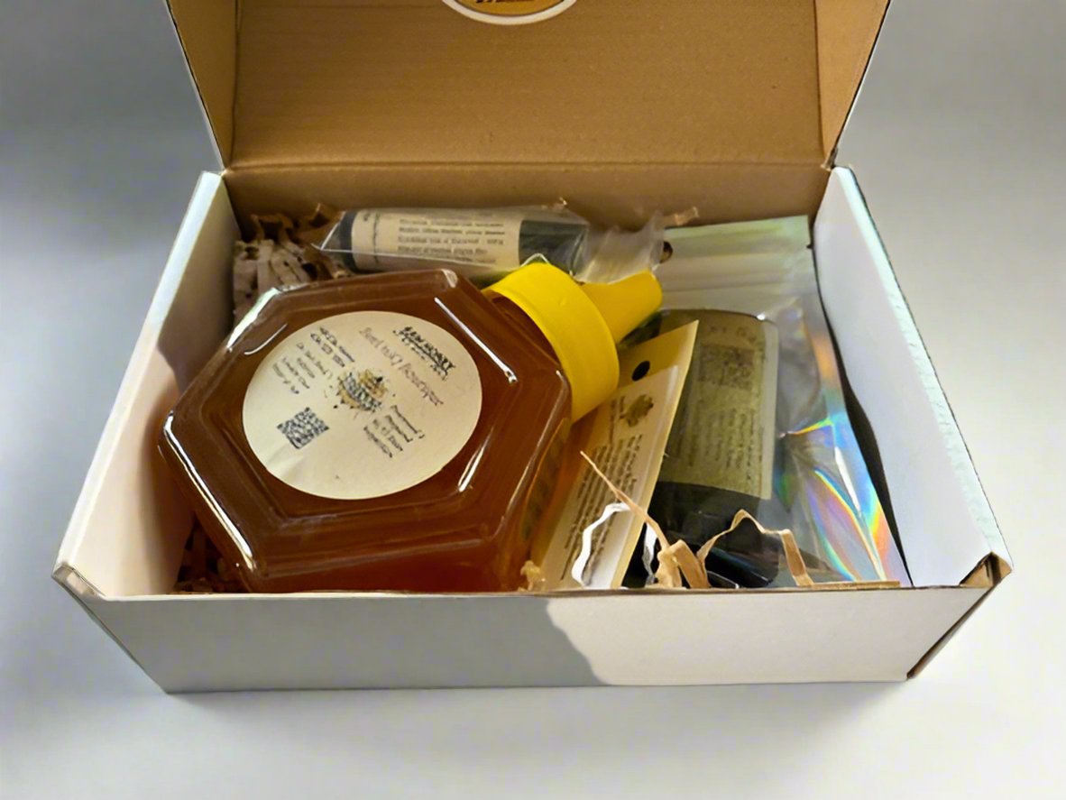 Box with honey, lip balm, and sick of salve.